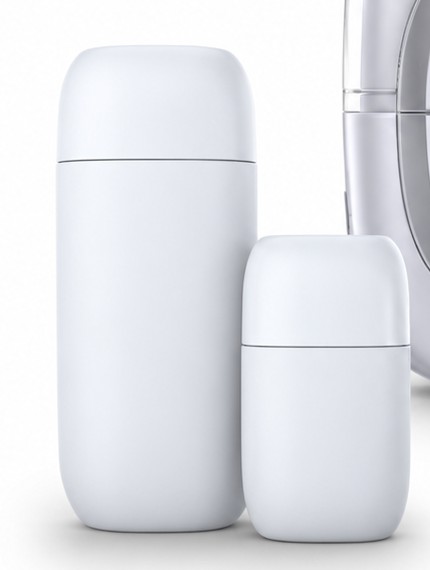 Two white capped travel bottles, one tall and one short